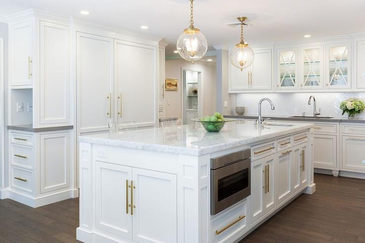 White kitchen with metal accents