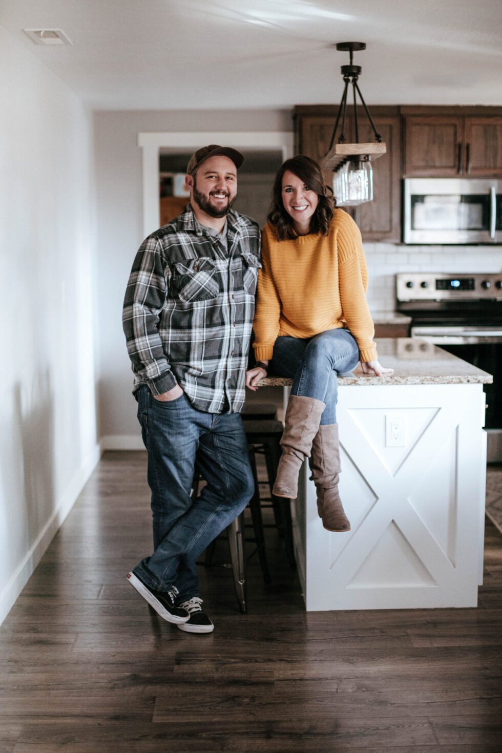 Happy homeowners in their new kitchen