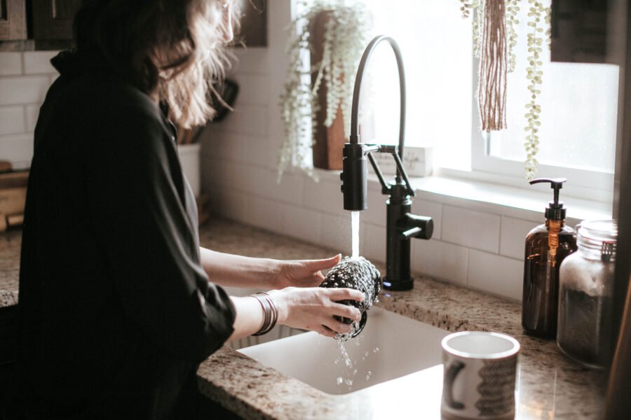 Kitchen sink with dark industrial faucet