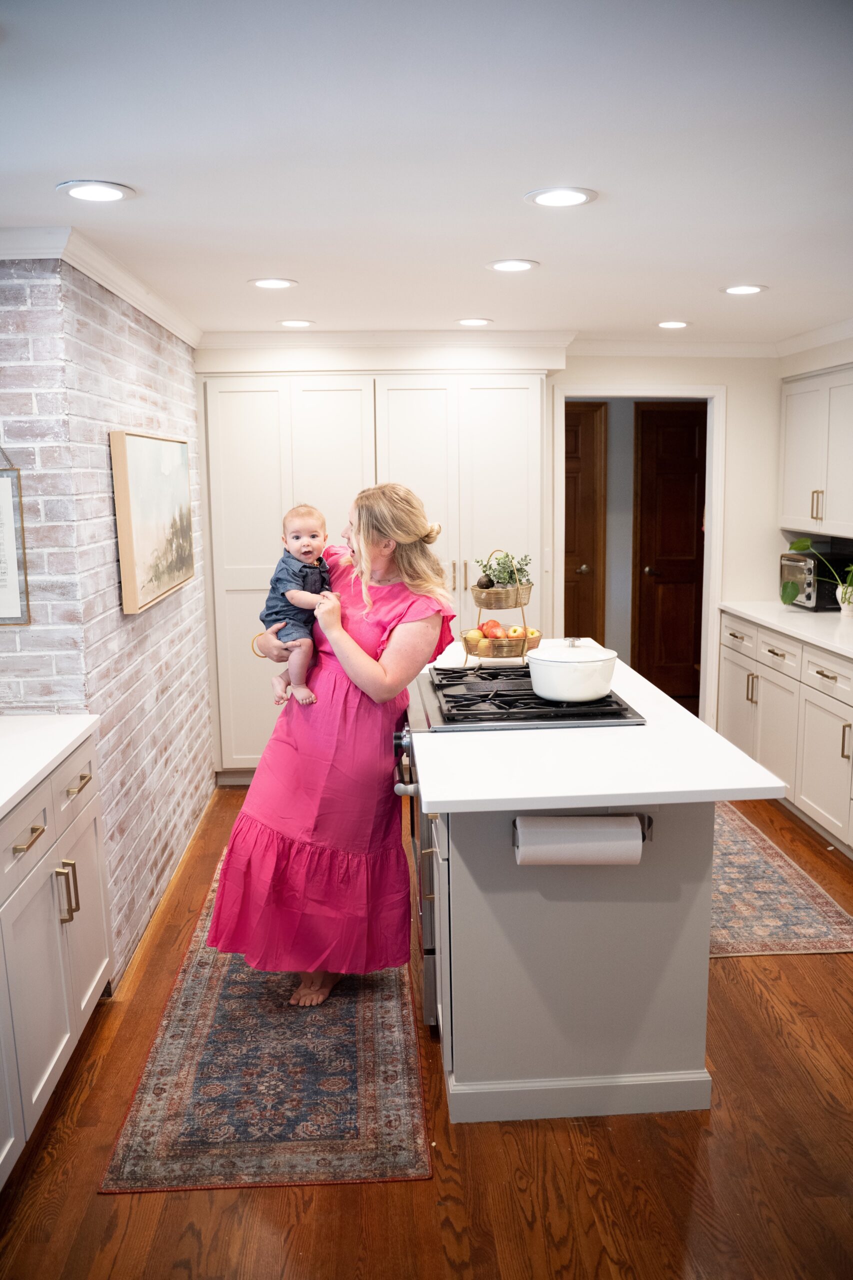 Woman and baby together at kitchen island