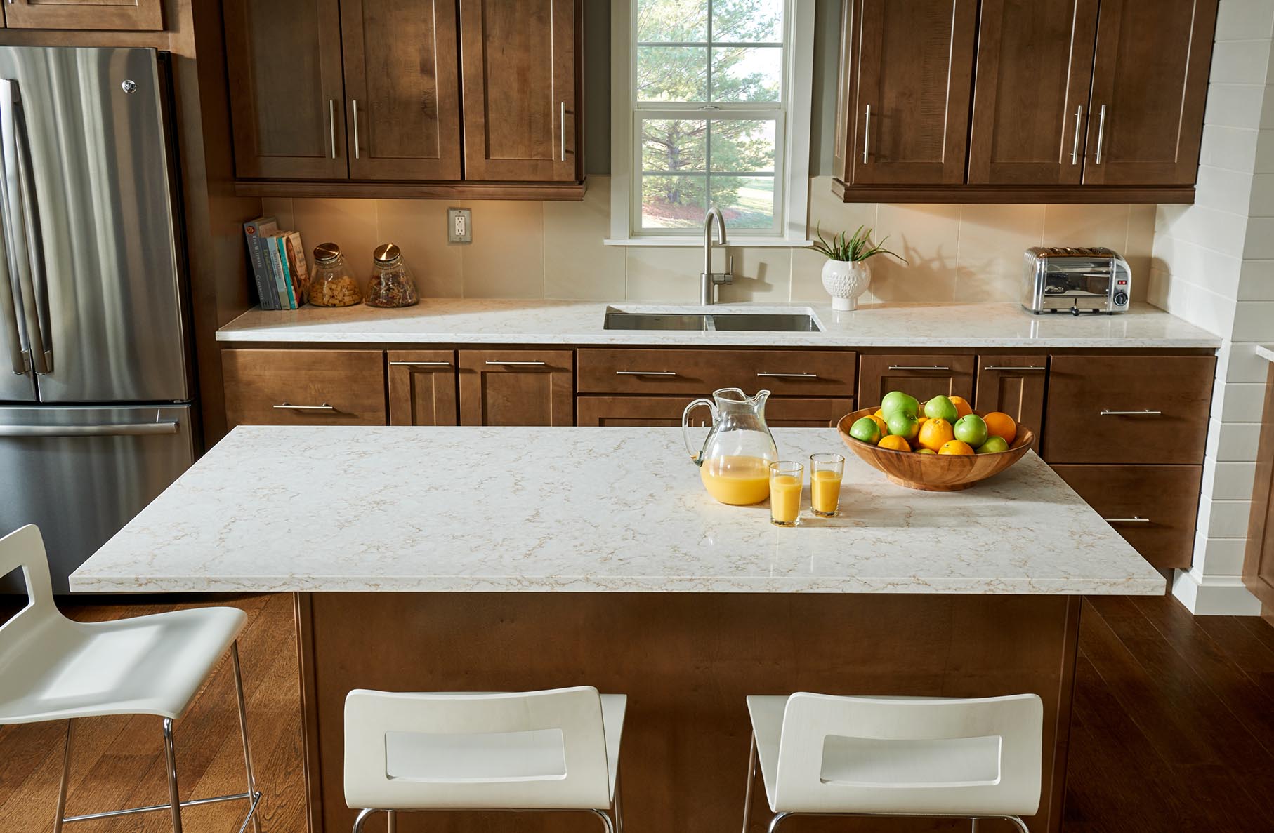 Viatara Clarino kitchen countertop with island, fruit bowl and orange juice