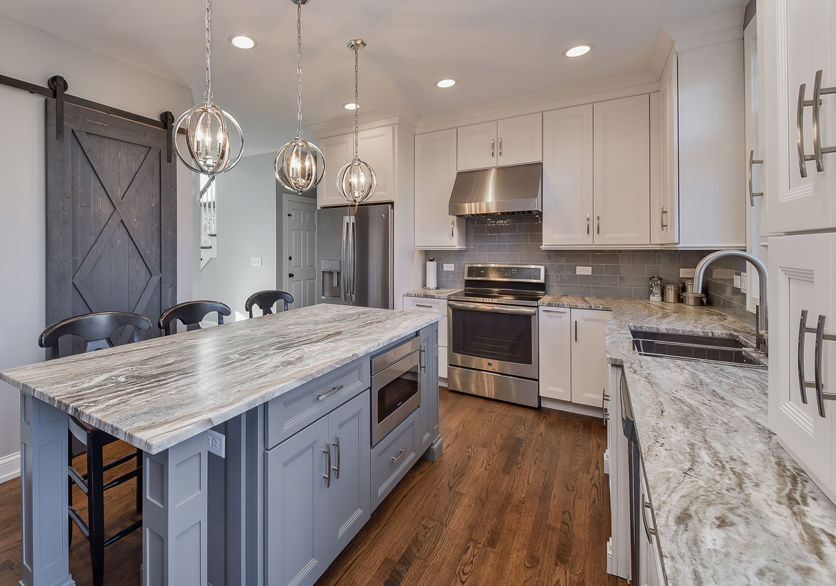 quartzite kitchen countertops with island and barn door