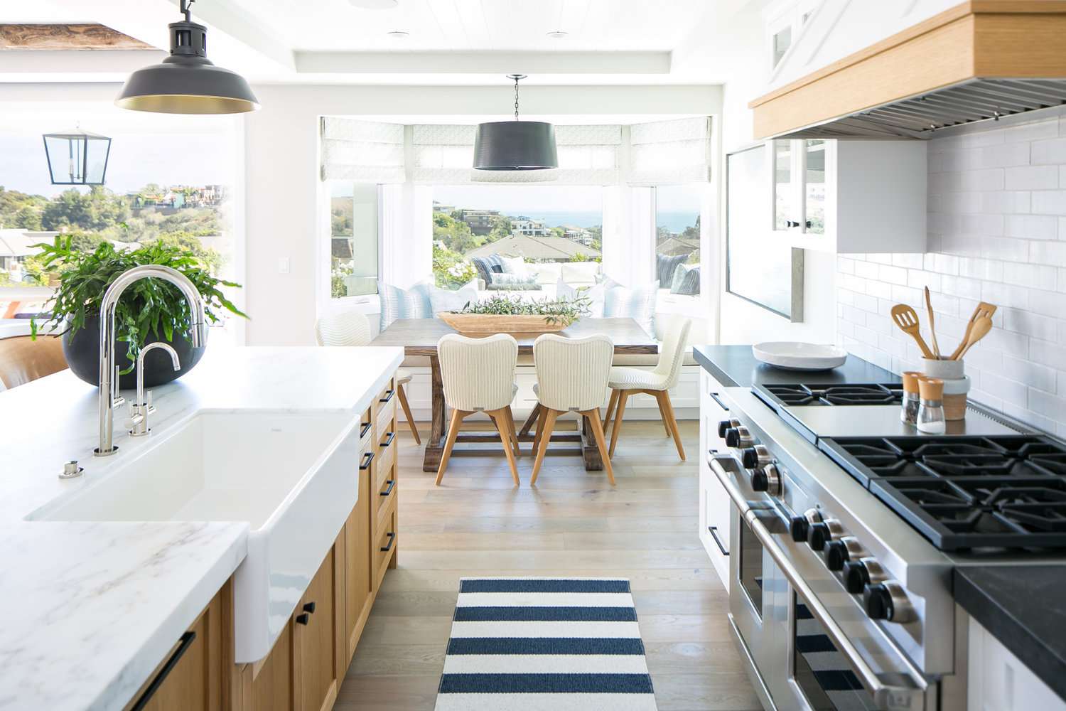 soapstone countertops in kitchen with dining table, sink and stove