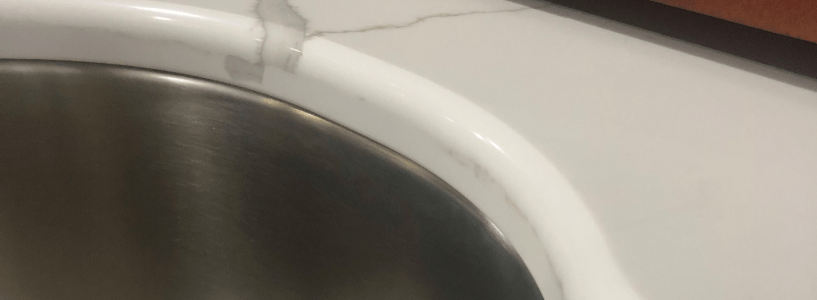 the chip minimizer around the edge of the countertop surrounding the sink