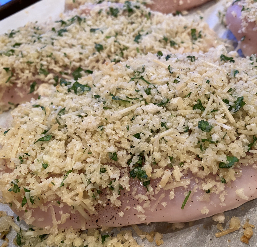 chicken topped with parmesan and herbs