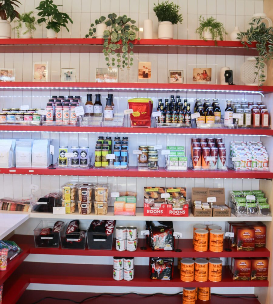 shelves full of multiple types of food and sauces at Tan Tan Deli
