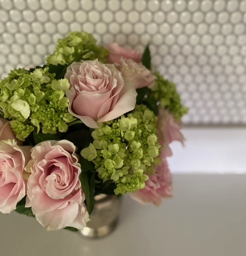 bouquet of pink roses and green hydrangas