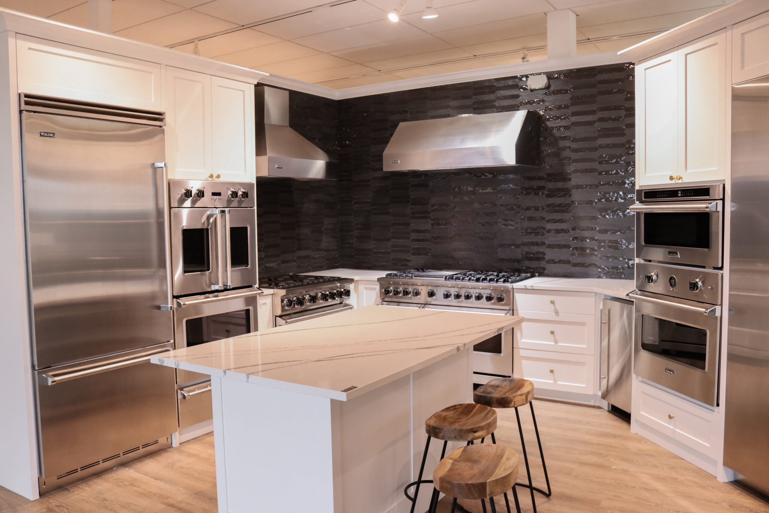 Basco kitchen showroom with quartz countertops and black backsplash