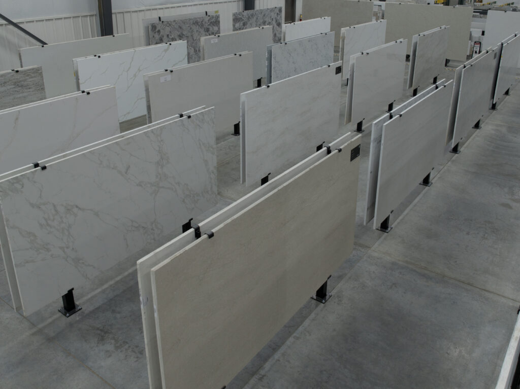 Aisle of full stone slabs in the Precision Countertops Wilsonville slab gallery
